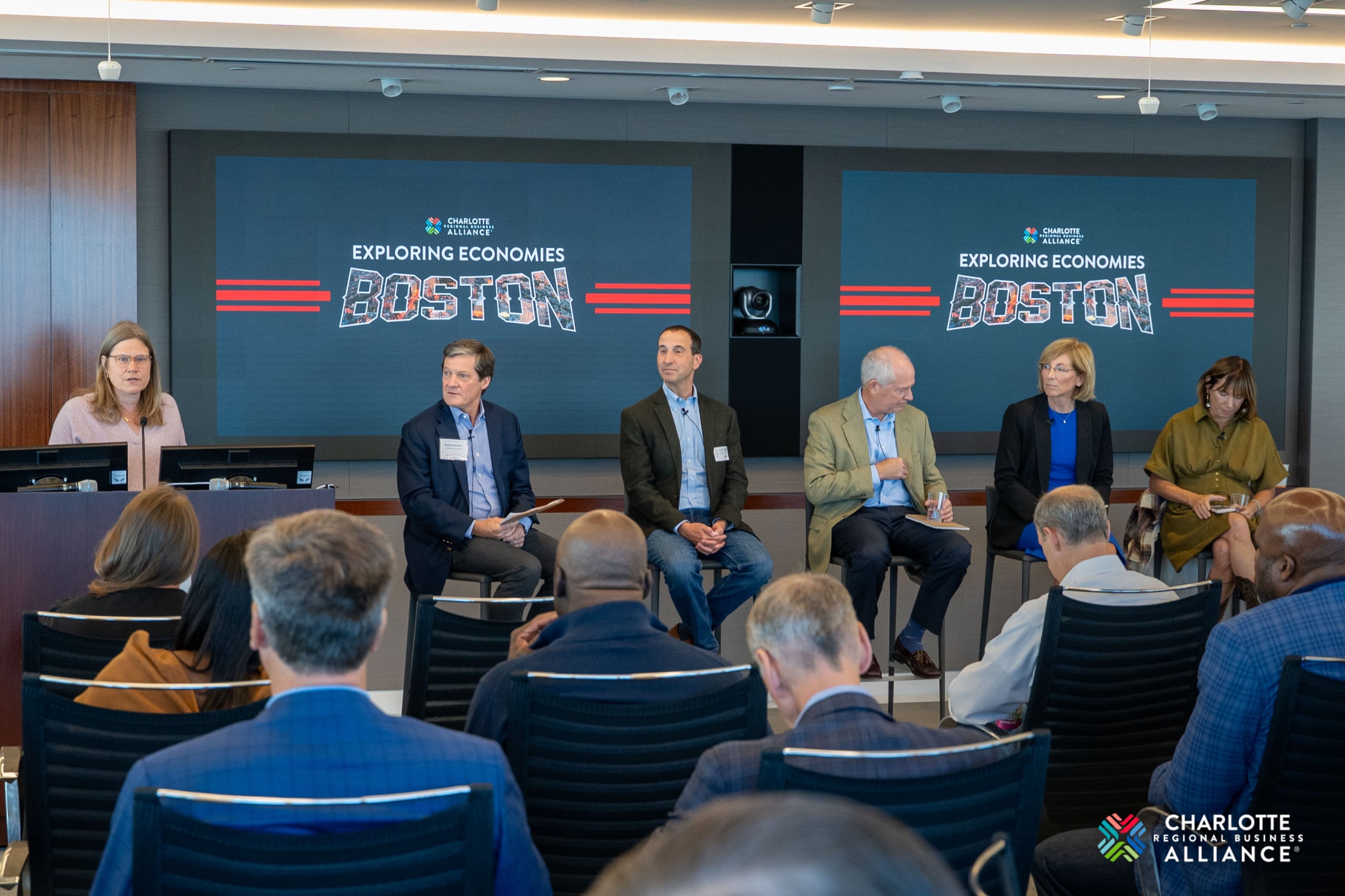 Boston and Charlotte workforce leaders discussing human capital investment.